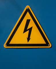 High voltage sign with lightning on a blue background. Danger high voltage. High voltage style modern font design, alphabet letters and numbers. Safety signs. Warning sign. Lightning symbol.