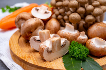 Wall Mural - Fresh ingredients for tasty vegetarian mushrooms soup, brown champignons, buna shimeji, carrots