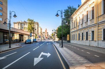 Wall Mural - Ancient and modern buildings and the bell tower of the Trinity Church on Pyatnitskaya Street in Moscow