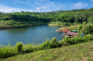 Wall Mural - Tourist hut in Mae Suai reservoir (or Dammed valleys) located at a narrow part of a valley downstream of a natural basin in Mae Suai district of Chiang Rai province of Thailand.