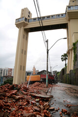 salvador, bahia / brazil - may 22, 2015: backhoe machine works in the demolition of destroyed buildings on Ladeira da Montanha in the city of Salvador. 
