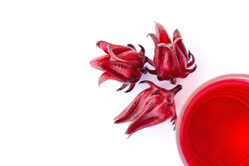 Wall Mural - glass of roselle juice tea and sorrel flower isolated on  white. 