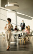 © BGStock72 - African American woman standing in office and wear mask as protection from corona virus