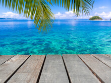 Wooden Floor Or Plank On Sea In Summer. For Product Display.Calm Sea And Blue Sky Background.