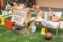 Various Things Placed On Table And Chairs In Backyard, Garage Sale Concept