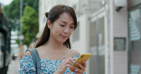 Canvas Print - Woman use of mobile phone at street