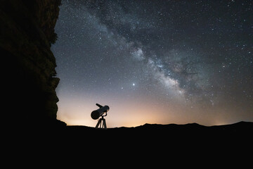 milky way and starry sky with telescope