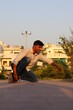 © eye.sky - Indian Young Boy Skate Boarding in Garden