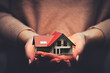 © Photocreo Bednarek - Home insurance, a house model safe in hands