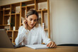 © bnenin - Concentrated young woman studying, portrait.
