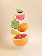 Citrus Still Life On A Light Background. Close Up View. Healthy Food And Diet. Orange, Lemon, Grapefruit, Lime. Levitation