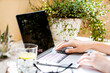 © Daria Minaeva - Woman's hands on laptop keyboard, cozy workplace