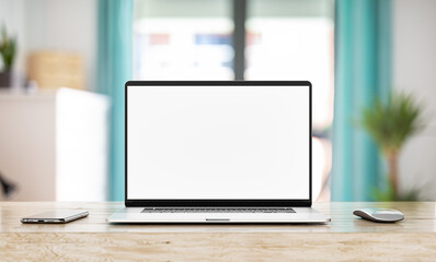 Wall Mural - laptop with blank screen on white table with mouse and smartphone. home interior or office backgroun