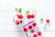 © 9dreamstudio - Raspberry and lime in ice cubes top view flat lay