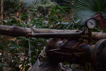 Canvas Print - Selective focus shot of an old rusty distillation machine