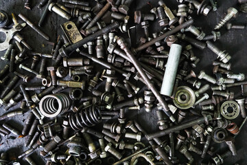 Old gears and old nut on wooden tables