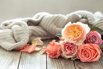 Wall Mural - Cozy arrangement with roses on a wooden table