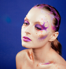 beauty young woman with creative make up, mystery tinsel