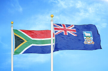 South Africa and Falkland Islands two flags on flagpoles and blue sky