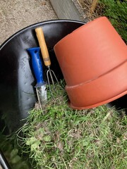 gardening tools in garden wheelbarrow