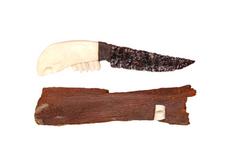 Obsidian knife with bone handle isolate on a white back. Prehistoric weapon made of volcanic glass.