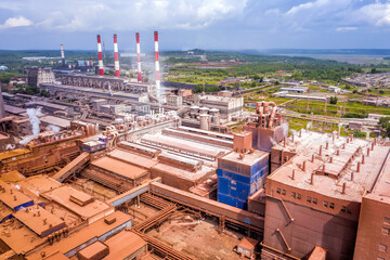 Smoke from pipes of metallurgical plant. View from above. Environmental pollution problem