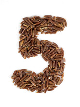 Arabic Numeral 5 Of Brown Rice Grains On An Isolated White Background.