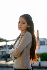 Wall Mural - Young beautiful Asian woman at the railway station