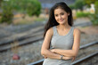 © Ranta Images - Young beautiful Asian woman at the railway station