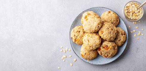 Wall Mural - Healthy vegan oat cookies. Grey background. Copy space. Top view.