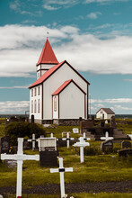 Old White Church In Iceland With Cemetary