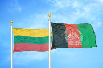 Lithuania and Afghanistan two flags on flagpoles and blue sky