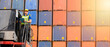 © godji10 - Portrait of confident inspector standing in front of containers in port, Dock worker with clipboard checking cargo freight shipping, Concept of transportation, logistics business. 21:9 wide photo