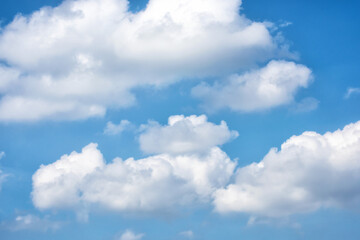 Bright blue cloudy sky on summer day.