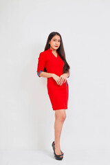 Wall Mural - Young beautiful business woman in red dress