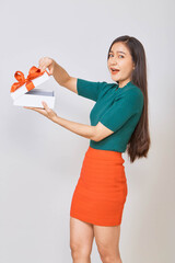 Wall Mural - Asian woman holding christmas gift