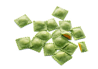 Uncooked colored ravioli pasta with pumpkin isolated on a white background