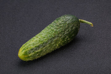 Green ripe fresh cucumber over background