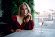© Olena_Molchanova - woman with glass of white wine in cafe or restaurant. sexy young blonde girl