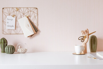 Mock up of woman workplace on light background. Business office desk with gold colors. Modern design. Minimal style.