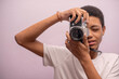 © rushay - Horizontal shot of teenager taking photos with vintage camera