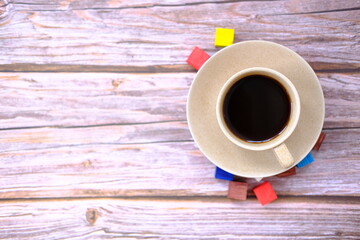 Wall Mural - cup of coffee on wooden table