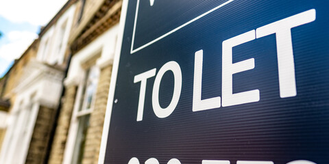 Wall Mural - Estate agency 'To Let' sign board on street of British houses