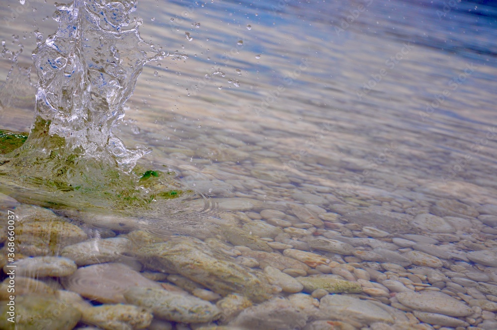 Stone Splashing Splashes, ripples, circles made by a stone thrown into the sea ...