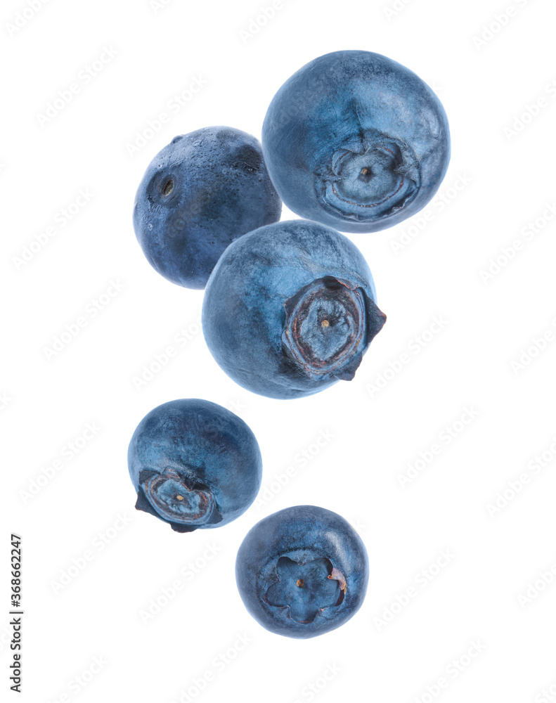 Many fresh ripe blueberries falling on white background - obrazy, fototapety, plakaty 
