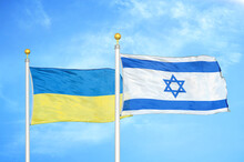 Ukraine And Israel Two Flags On Flagpoles And Blue Sky