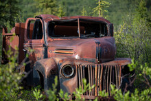 Vintage, Rusty, Old Truck Nestled In The Wilderness With Summertime Mountain Background.