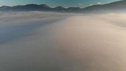 Poster - Amazing landscape scenario of mountains and countryside over the clouds