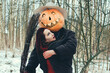 witch and a Halloween pumpkin hug