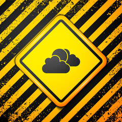 Black Sun and cloud weather icon isolated on yellow background. Warning sign. Vector.